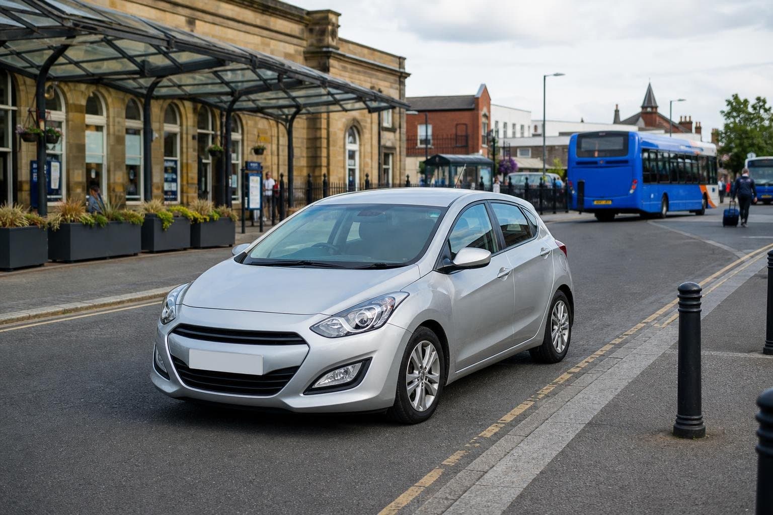 Compact hire car on a commuter route near Leigh town centre
